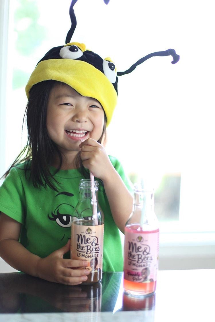 cute asian child drinking lemonade